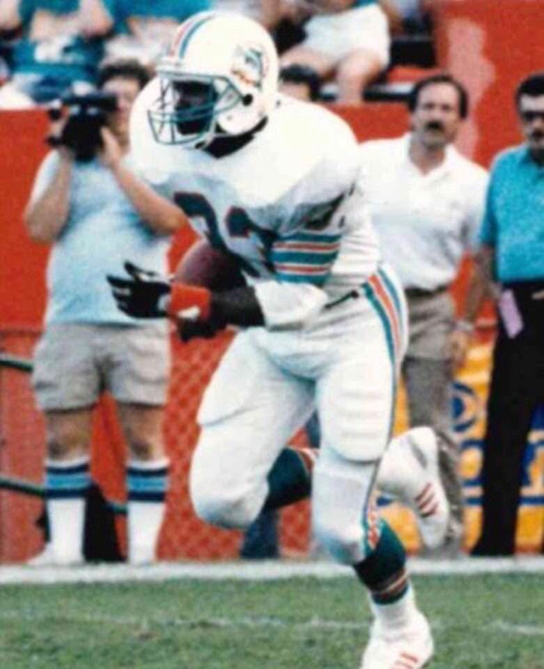 Craig Ellis running the ball for the Miami Dolphins