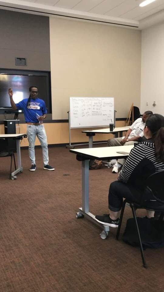 Craig Ellis addressing a room of adults