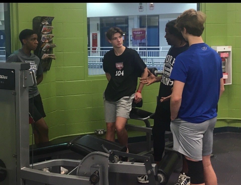 Craig Ellis coaching young athletes in the weight room
