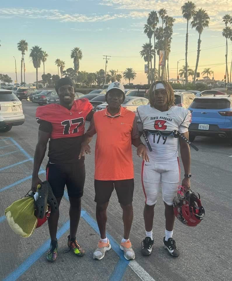 Craig Ellis with two of the athletes he mentors