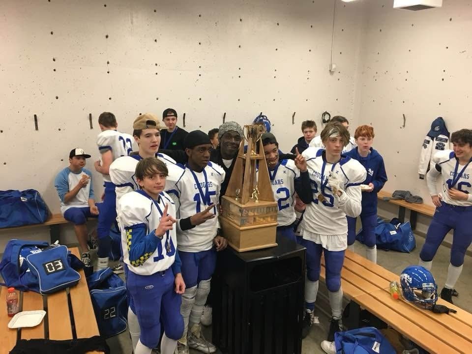 Craig Ellis celebrating a championship with his youth team