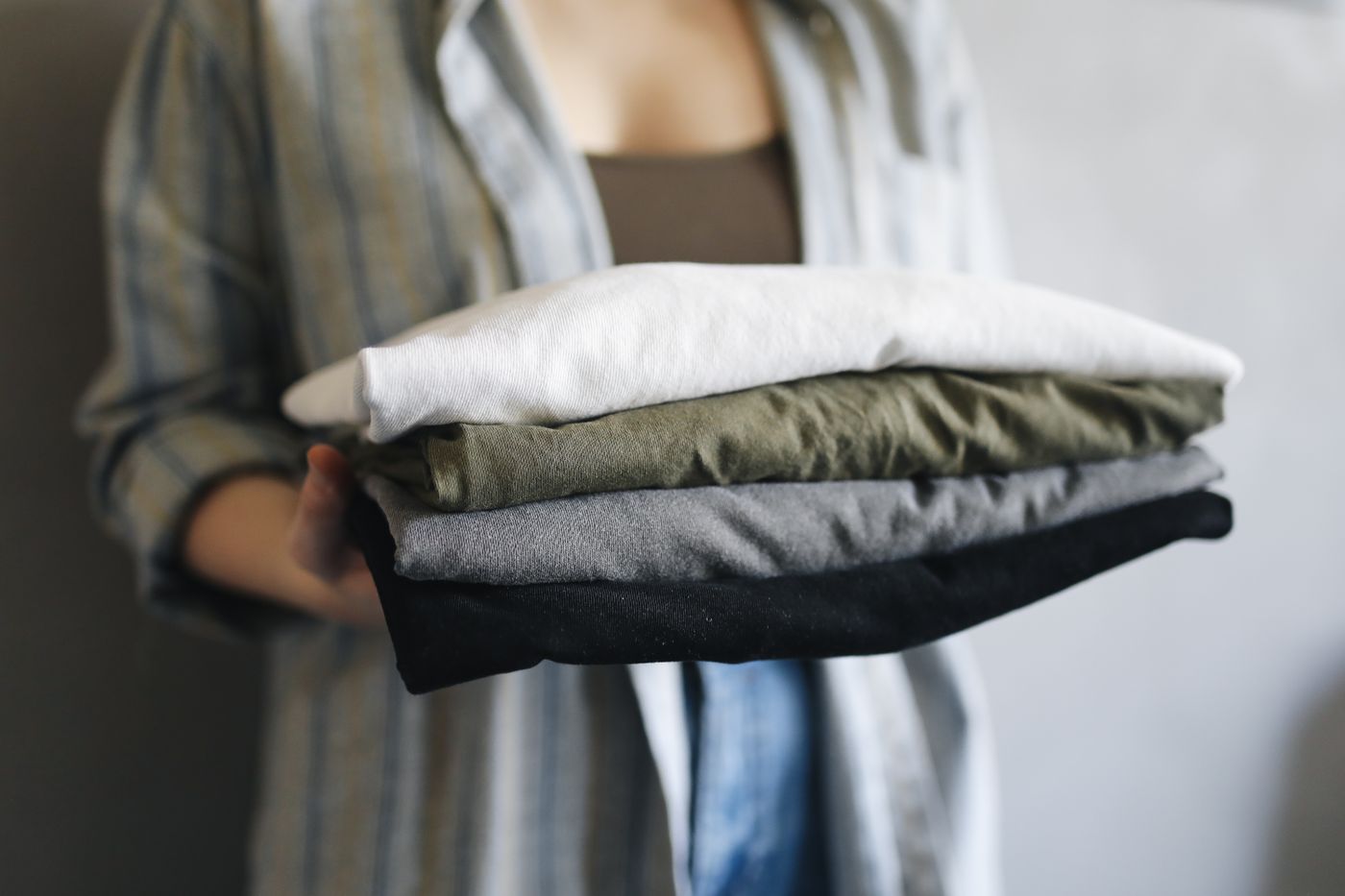 A stack of folded t-shirts