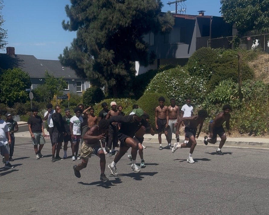Los Angeles inner-city student athletes sprinting through a speed and conditioning session run by Alumni In Action
